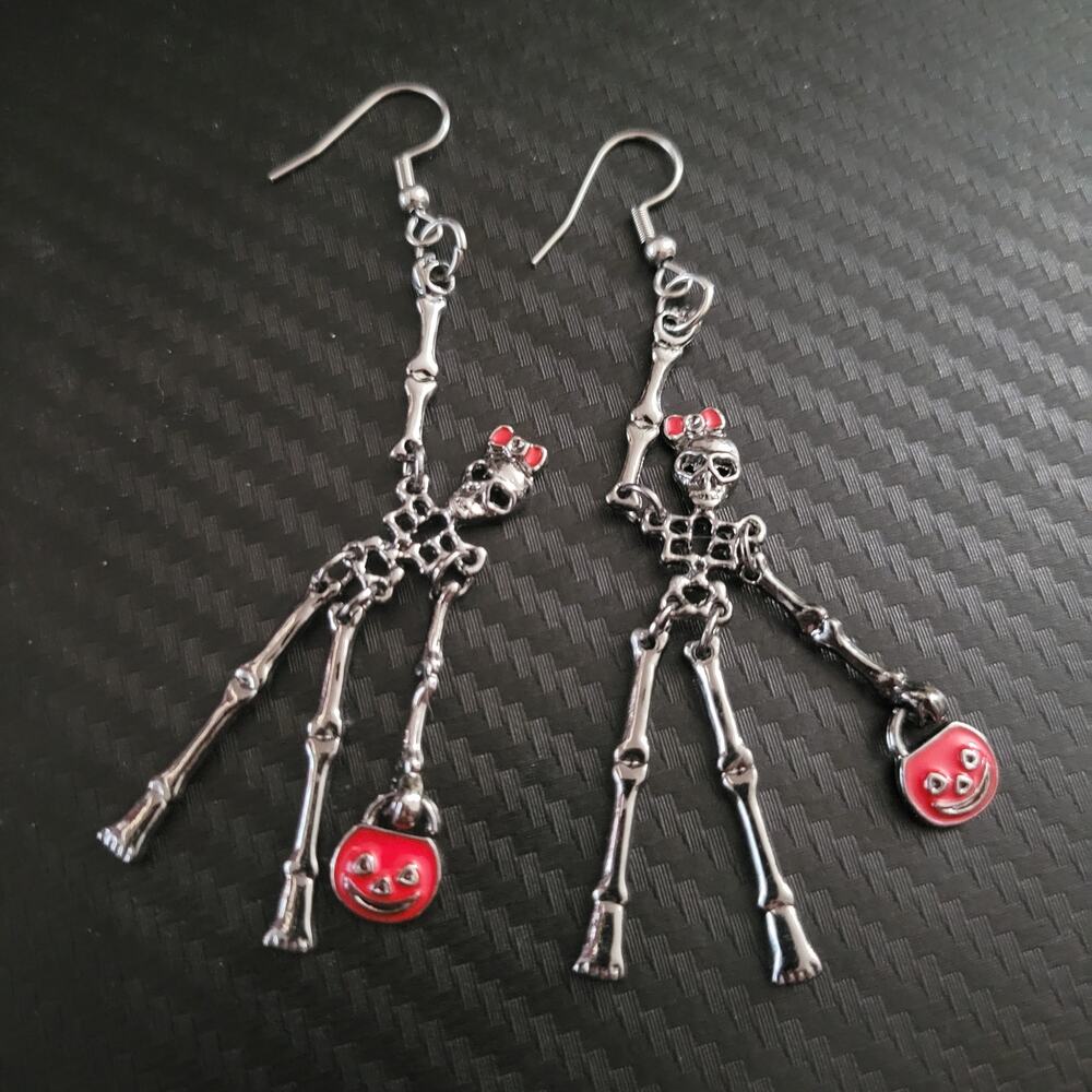 Skeleton girl w/ pumpkin trick-or-treating halloween earrings, movable limbs